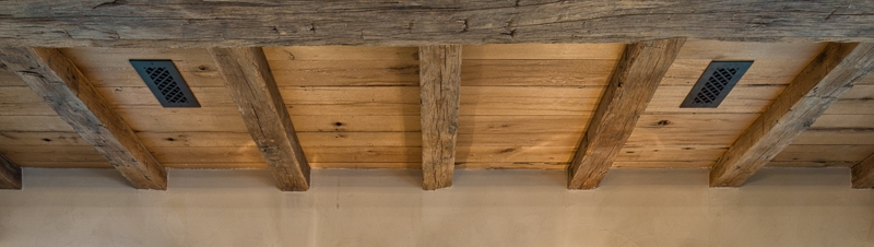 Reclaimed hand hewn beams and reclaimed ceiling boards