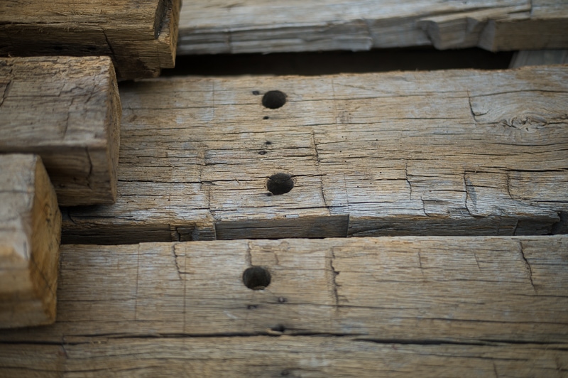 weathered reclaimed hewn old beams