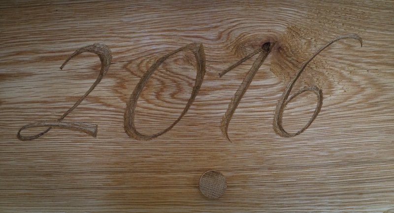 carving the date into a beam